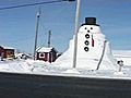 Man,  50 Friends Build Massive Snowman