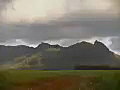 Royalty Free Stock Video SD Footage Zoom Out From Mountain Range and Fields to Dirt Road in Kauai,  Hawaii