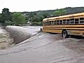 Public Buses Cross Flooded Bridge in Nicaragua