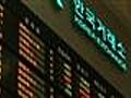 World markets tumble on Dubai debt,  weak dollar