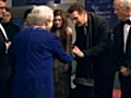 Queen ventures into snow to meet stars