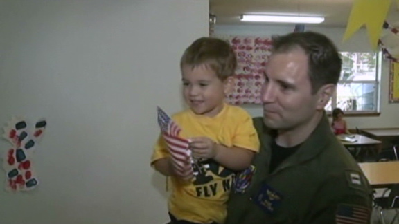 Navy pilot reunited with 3-year-old son