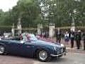 The Duke & Duchess Of Cambridge Leave Buckingham Palace In Aston Martin