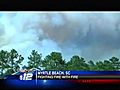 Firefighters battle against wildfires in Myrtle Beach using burnouts