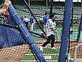 Nick Jonas gets some swings in during Cubs batting practice