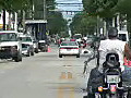 Royalty Free Stock Video HD Footage Traffic and Bicycle and Motorcycle Riders on Duvall Street in Key West Florida