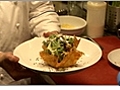 Arranging Finished Caesar Salad in Parmesan Basket