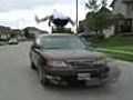 Boy jumps over a moving car