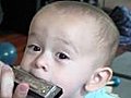 Baby Plays Harmonica,  but he’s Faking it