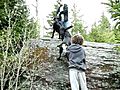 Icarium jumping and climbing up a rock.