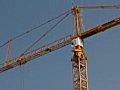 Royalty Free Stock Video SD Footage Pan to Top of a Tower Crane Operating at a Construction Project in Ft. Lauderdale,  Florida