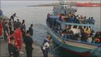 Watch                                     Embattled Libyans flee to Italian island