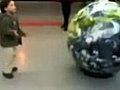 Little Kid Gets Owned by Giant Globe