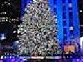 Tree lights up Rockefeller Center