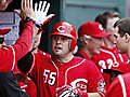 Reds sink Cards,  take division lead