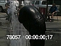 MAN COOLS OFF AT FOUNTAIN - HD