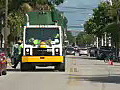 Royalty Free Stock Video HD Footage Traffic,  Pedestrians and a Garbage Truck on Duvall Street in Key West Florida