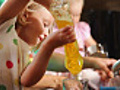 LIttle girls help mom with dishes