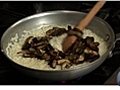 Adding Stock and Mushrooms to the Rice for Risotto