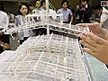 会見で原子炉建屋カバーの模型を公開／東京電力