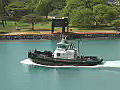 Royalty Free Stock Video HD Footage Tugboat Leaves the Harbor in Honolulu,  Hawaii