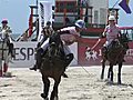 Vacationers,  residents watch beach polo action