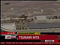 Raw video: Tsunami hits airport in Japan