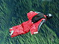 Man, mountain, wingsuit