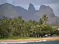 Royalty Free Stock Video SD Footage Zoom Out From Mountain Range and Inlet on Beach in Kauai,  Hawaii