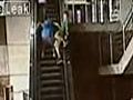 Teen falls off top of escalator