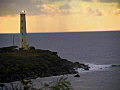 Royalty Free Stock Video SD Footage Close Up of Light Beacon Flashes Light at Sunrise on Beach in Kauai,  Hawaii