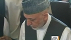 Karzai mourns dead half-brother,  climbs in grave