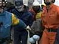 In Japan,  rescuers find 80-year-old, teen