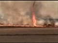 Fire tornado rips through fields in Brazil